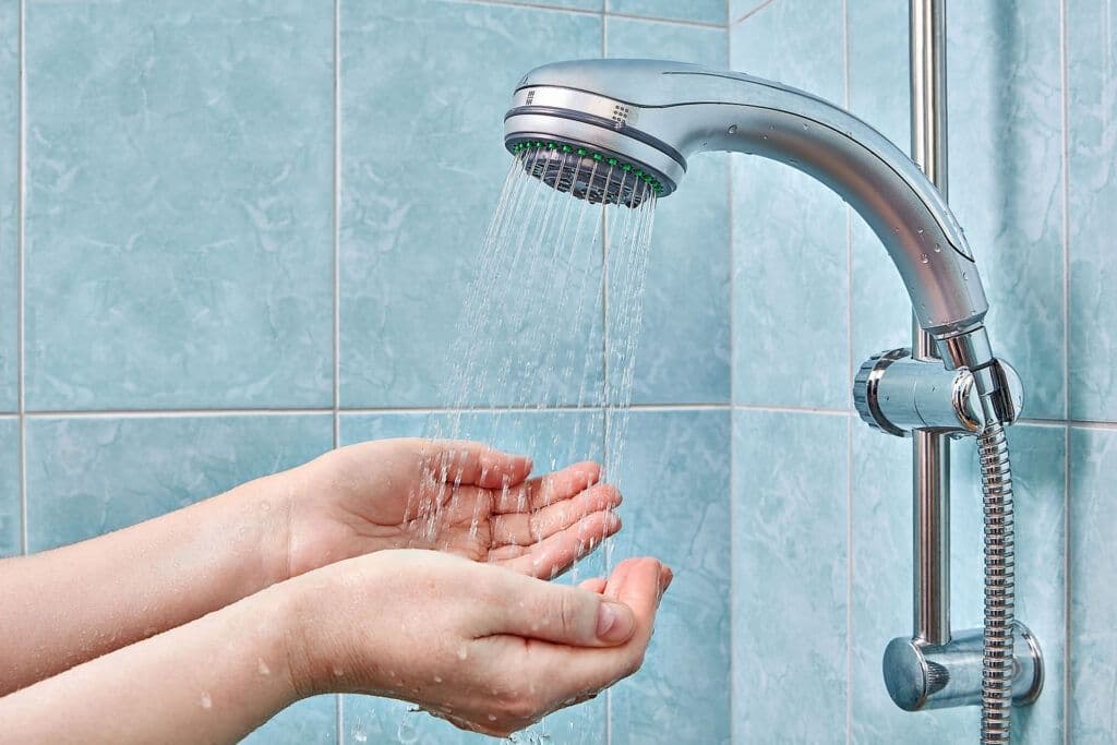 two human palm in hundfuls under shower